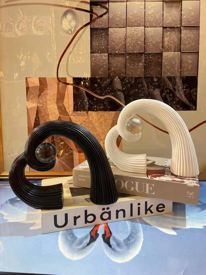 Black and white ribbed arc sculptures